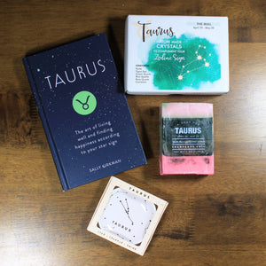 Contents of the "What's Your SIgn? - Taurus" zodiac gift box by Doromania with a Taurus ring dish, Taurus Book, Taurus crystals, and Taurus soap