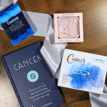 Load image into Gallery viewer, Cancer themed gift items from the "What's Your Sign?" Cancer zodiac gift box. Gifts include Cancer astrology soap, cancer trinket dish, Cancer crystals, and a Cancer horoscope book