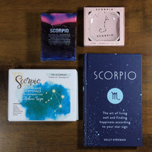 Load image into Gallery viewer, Contents of What's Your Sign Scorpio gift box: blue Scorpio horoscope book, box of Scorpio natural crystals, pink scorpio ring dish, and purple and blue Scorpio soap