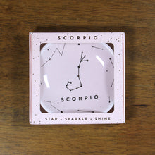 Load image into Gallery viewer, Scorpio Zodiac Ring Dish from Lucky Feather. Blush pink ring dish with gold print. Ring dish says Scorpio and has an illustration of the Scorpio constellation. 