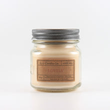 Load image into Gallery viewer, Mason Jar candle: an 8 oz mason jar with a metal cap, filled with off white wax, with a kraft paper label on the front that reads "Lovely"