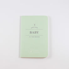 Load image into Gallery viewer, Small light mint green passport journal from Letterfolk with silver print that says "Another Baby in the books"