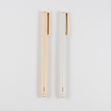 Load image into Gallery viewer, A photo of two pens, one white and one blush pink, side by side. They both have a gold clip on the cap, and a gold "SP" logo at the end.