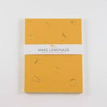Load image into Gallery viewer, A photo of a rectangle journal with lemons etched on the cover. A paper band around the outside says "Make Lemonade"