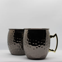 Load image into Gallery viewer, Two black hammered mugs for moscow mules