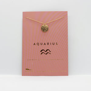 Aquarius necklace: Gold pendant necklace with aquarius constellation on pink card packaging