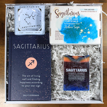 Load image into Gallery viewer, What&#39;s Your Sign Sagittarius Gift Box: photo shows a white gift box with crinkle paper, filled with a sagittarius book, sagittarius ring dish, sagittarius crystals, and sagittarius soap.