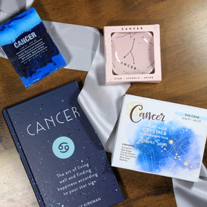 Cancer themed gift items from the "What's Your Sign?" Cancer zodiac gift box. Gifts include Cancer astrology soap, cancer trinket dish, Cancer crystals, and a Cancer horoscope book