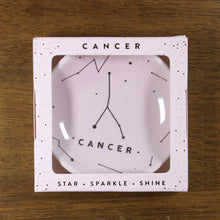 Load image into Gallery viewer, Cancer Zodiac Ring Dish from Lucky Feather. Blush colored ring dish with gold print. Ring dish says Cancer and has an illustration of the Cancer constellation.