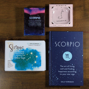 Contents of What's Your Sign Scorpio gift box: blue Scorpio horoscope book, box of Scorpio natural crystals, pink scorpio ring dish, and purple and blue Scorpio soap