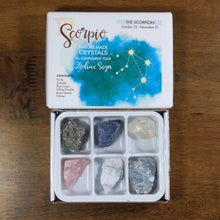 Load image into Gallery viewer, Scorpio Horoscope Crystals from Rock Paradise. Photo shows a white box that has a blue ink blot with the Scorpio constellation and illustrations of gemstones. The box reads &quot;Scorpio nature made crystals to complement your zodiac sign.&quot; Box has 6 crystals in it.