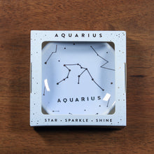 Load image into Gallery viewer, Aquarius Zodiac Ring Dish from Lucky Feather. Light blue colored ring dish with gold print. Ring dish says Aquarius and has an illustration of the Aquarius constellation.