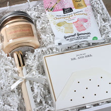 Load image into Gallery viewer, angled view of dearly beloved wedding gift box with candle, gummies, note cards and felt pens in a white box with white crinkle paper