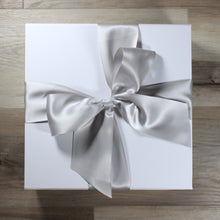 Load image into Gallery viewer, overhead view of white gift box with silver satin ribbon tied in a bow