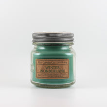 Load image into Gallery viewer, Mason Jar candle: an 8 oz mason jar with a metal cap, filled with green wax, with a kraft paper label on the front that reads &quot;Winter Wonderland&quot;