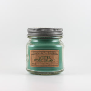 Mason Jar candle: an 8 oz mason jar with a metal cap, filled with green wax, with a kraft paper label on the front that reads "Winter Wonderland"