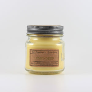Mason Jar candle: an 8 oz mason jar with a metal cap, filled with yellow wax, with a kraft paper label on the front that reads "Lemondrop"