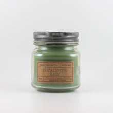 Load image into Gallery viewer, Mason Jar candle: an 8 oz mason jar with a metal cap, filled with green wax, with a kraft paper label on the front that reads &quot;Eucalyptus Sage&quot;
