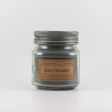 Load image into Gallery viewer, Mason Jar candle: an 8 oz mason jar with a metal cap, filled with grey wax, with a kraft paper label on the front that reads &quot;Nag Champa&quot;