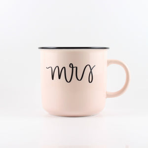 Mrs. ceramic mug from Sweet Water Decor. Light pink ceramic mug with "mrs" printed on it in black letters