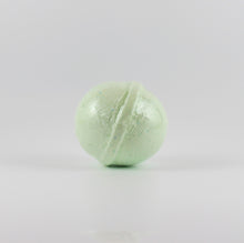 Load image into Gallery viewer, A mint green colored, oval shaped bath bomb on a white background