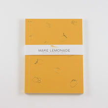 Load image into Gallery viewer, A photo of a rectangle journal with lemons etched on the cover. A paper band around the outside says &quot;Make Lemonade&quot;