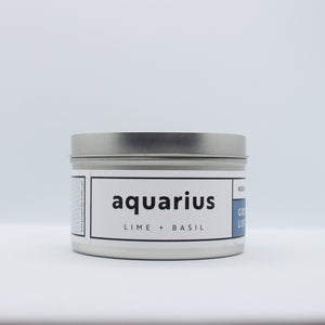 aquarius candle: aluminum tin candle with white label