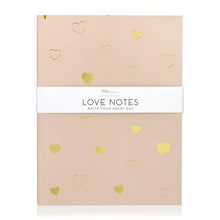 Load image into Gallery viewer, A light pink journal with hearts in solid gold and gold line art. A band around the journal says &quot;Love notes, write your heart out.&quot;