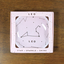 Load image into Gallery viewer, Leo Zodiac Ring Dish from Lucky Feather. Blush blue colored ring dish with gold print. Ring dish says Leo and has an illustration of the Leo constellation.