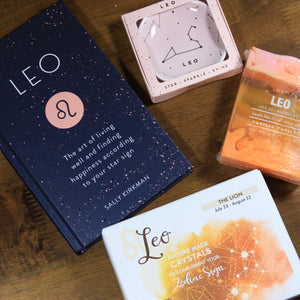 Photo shows the contents of the What's Your Sign Leo Gift Box: Leo book, Leo ring dish, Leo crystals, and Leo soap. 