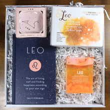 Load image into Gallery viewer, What&#39;s Your Sign Leo Gift Box: photo shows a white gift box with crinkle paper, filled with a Leo book, Leo ring dish, Leo crystals, and Leo soap.
