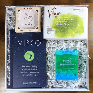 overhead view of what's your sign virgo zodiac gift box with crystals, soap, book and ring dish in white box with white crinkle paper